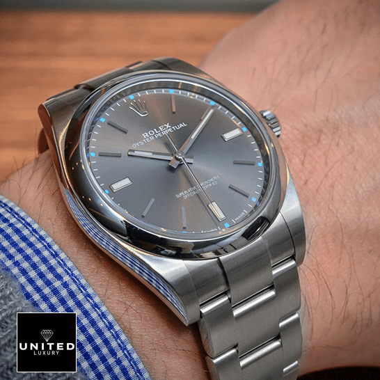 Rolex Datejust Perpetual 114300 dial is a dark rhodium grey Replica on his arm
