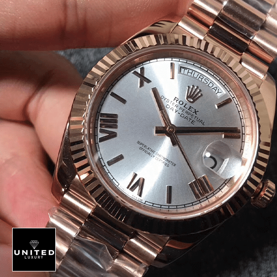 Rolex day-date roman wihte dial replica on the hand
