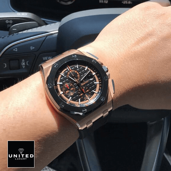 Audemars Piguet Black Bezel Replica on the steering wheel on a man